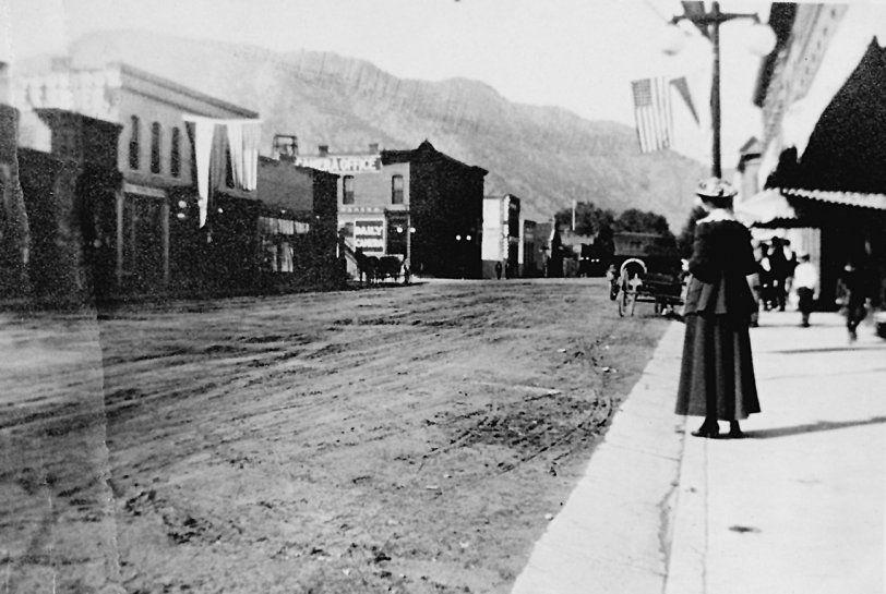 My mother was born in 1916.  This shot of the main street in Boulder Colorado shows my grandmother standing on the sidewalk, perching her hands on her swollen belly, gazing toward the Daily Camera office and the foothills of the Front Range.  Photograph by Harold V. Hartsough

Don Hall
Yreka, CA